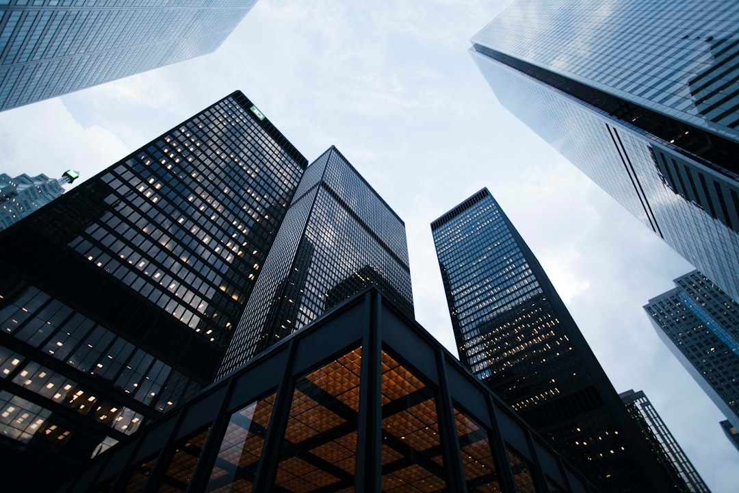 low angle photo of city high rise buildings during daytime